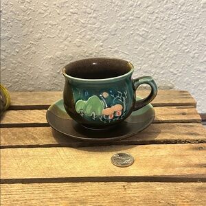 Green & Brown Ceramic Cup and Saucer Set with a whimsical cottage design, Nature